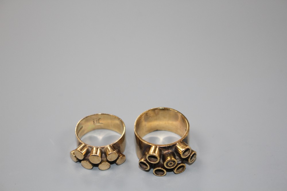 Two 1960s modernist 9ct gold dress rings, both decorated with raised cylindrical motifs, maker JB, London, 1968, sizes O and S.